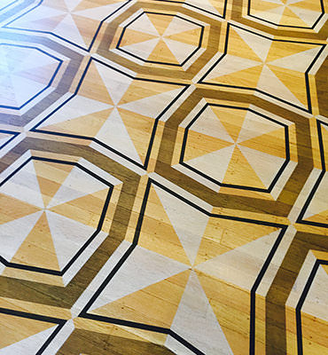 Geometric stencil stained floor